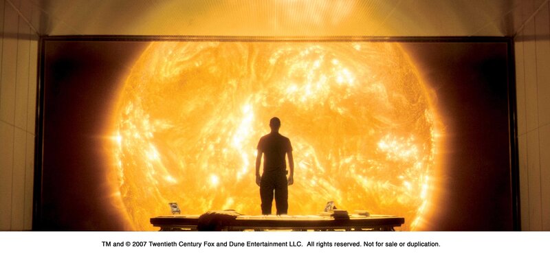 Man stands before sun