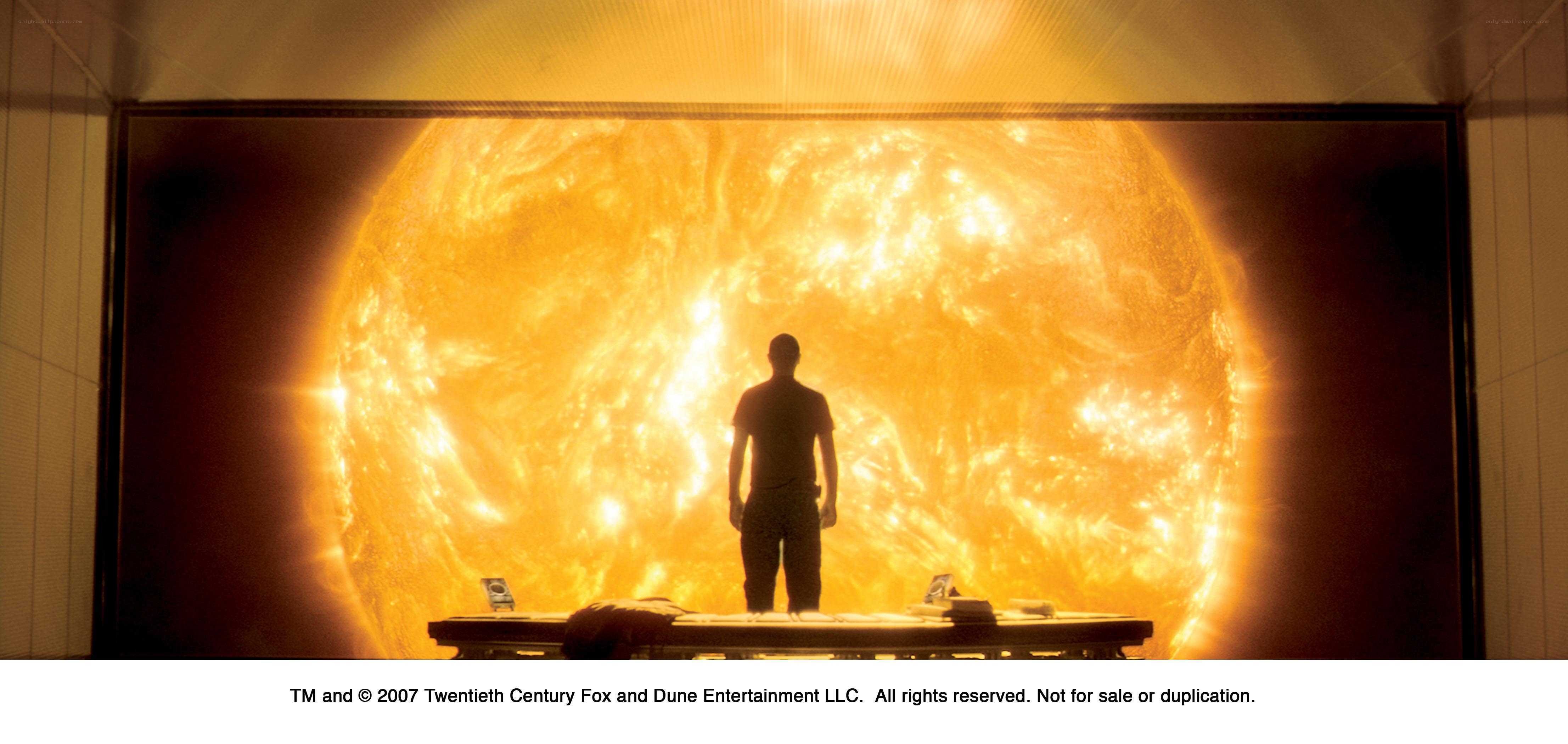 Man stands before sun