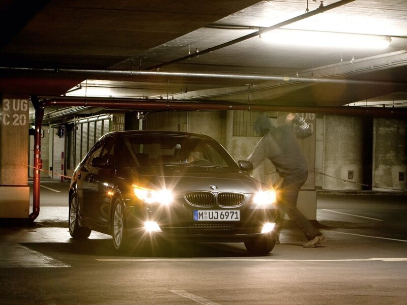 Man stealing car in parking garage