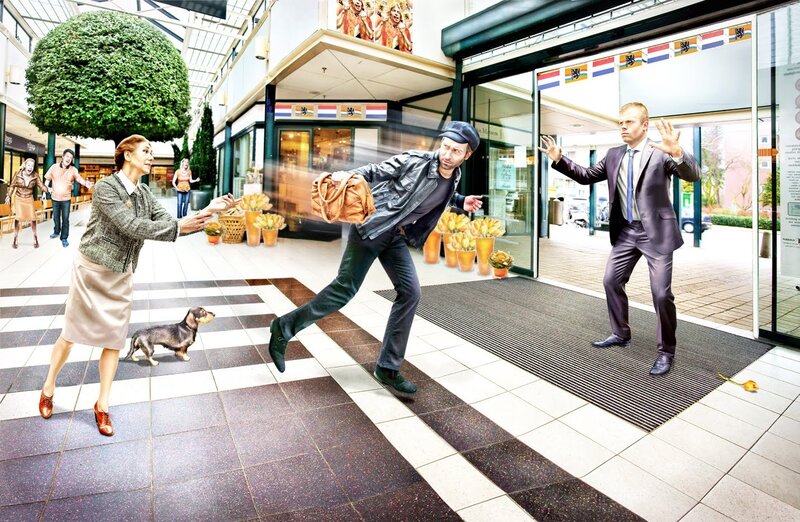 Man stealing purse in shopping mall
