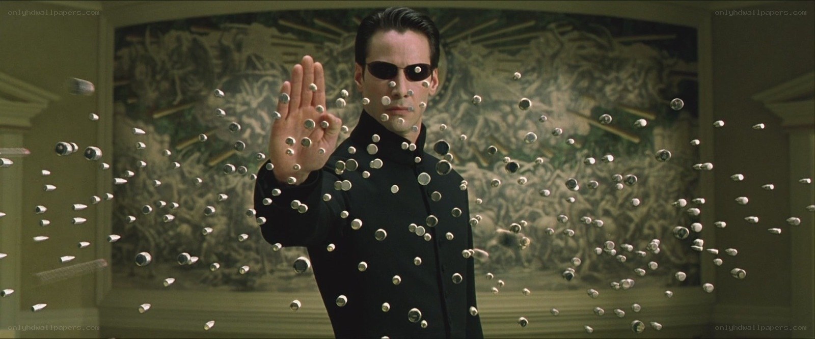 man stopping bullets with hand
