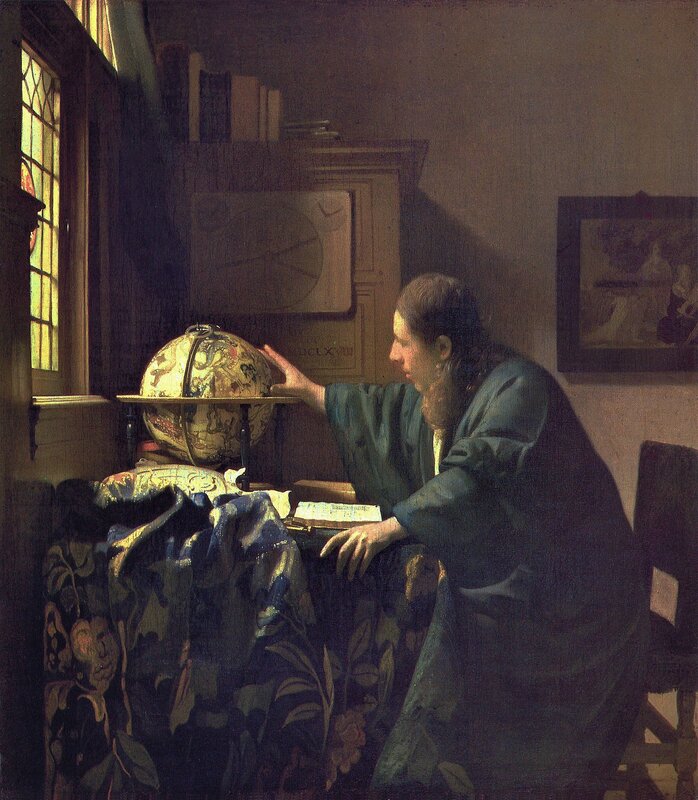 Man Studying Globe