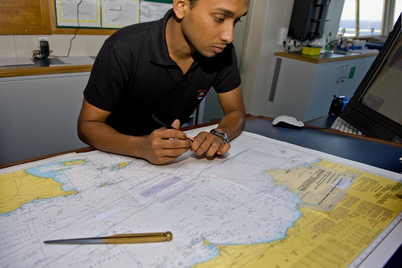 Man Studying Nautical Chart — Yellow