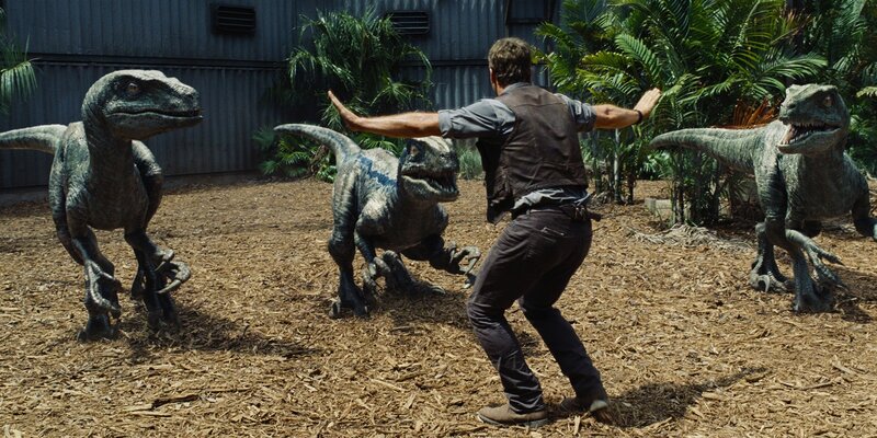 Man Surrounded by Dinosaurs