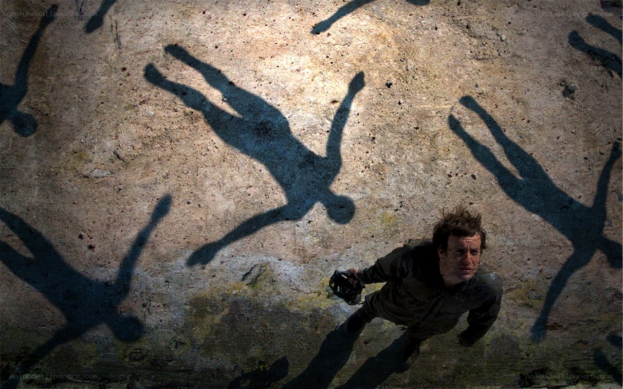 Man surrounded by shadow figures