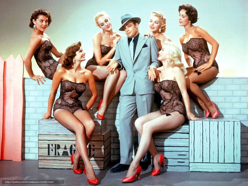 Man surrounded by women in lingerie