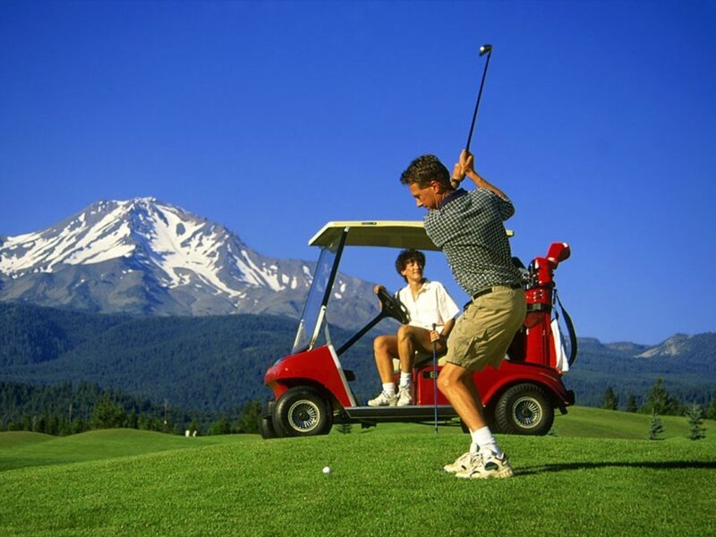 Man Swinging Golf Club