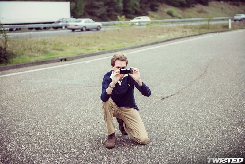man taking photo on road