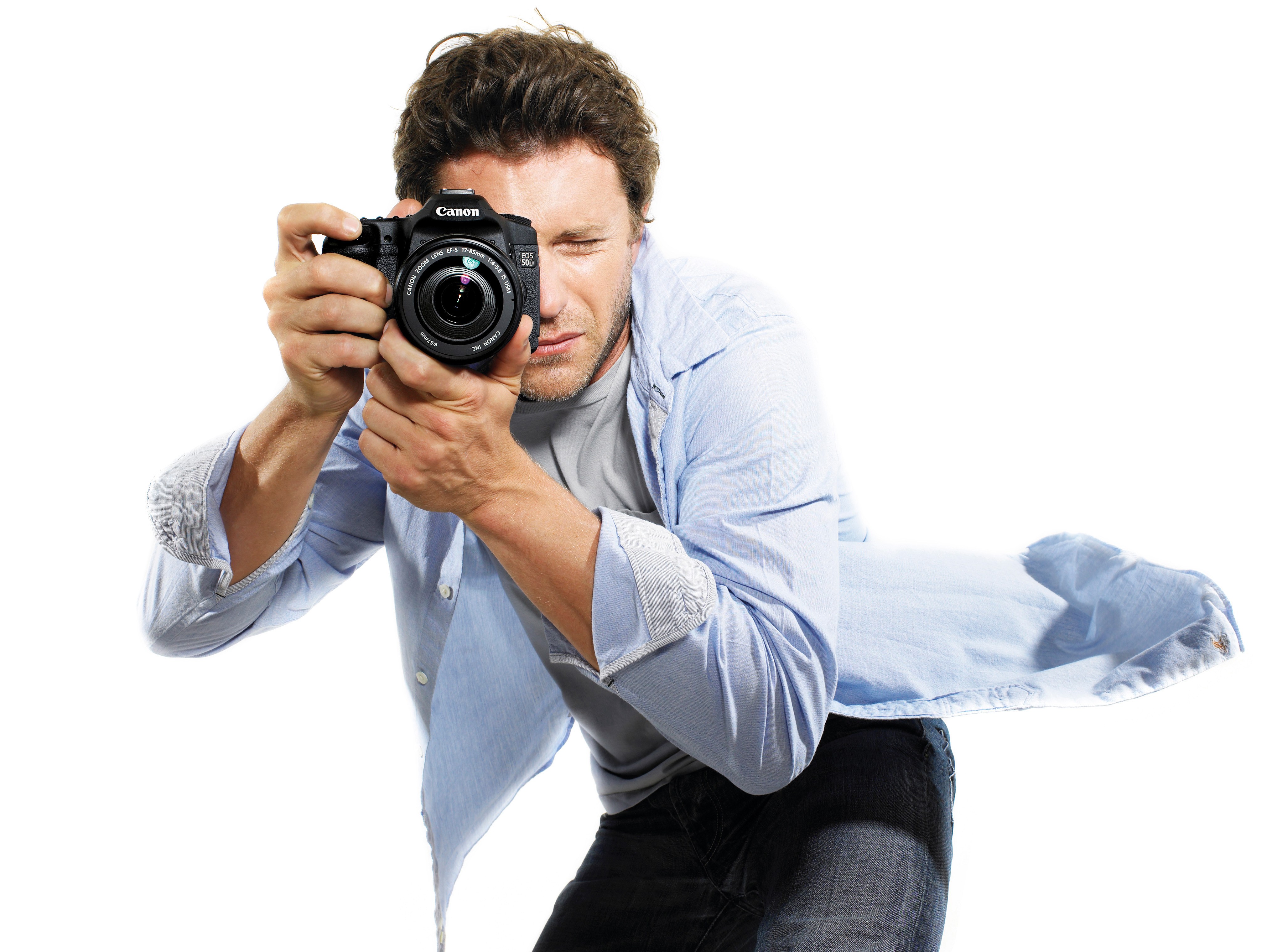 man taking photo with canon camera