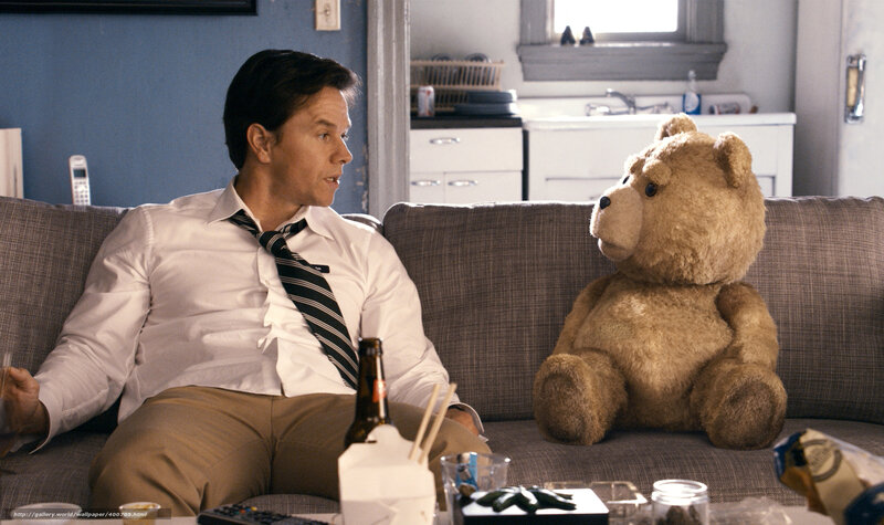 Man talking to teddy bear