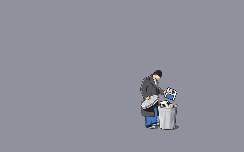 man throwing floppy disk in trash