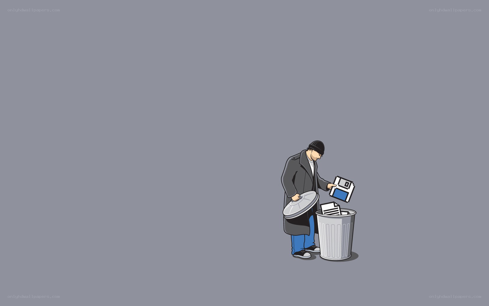 man throwing floppy disk in trash