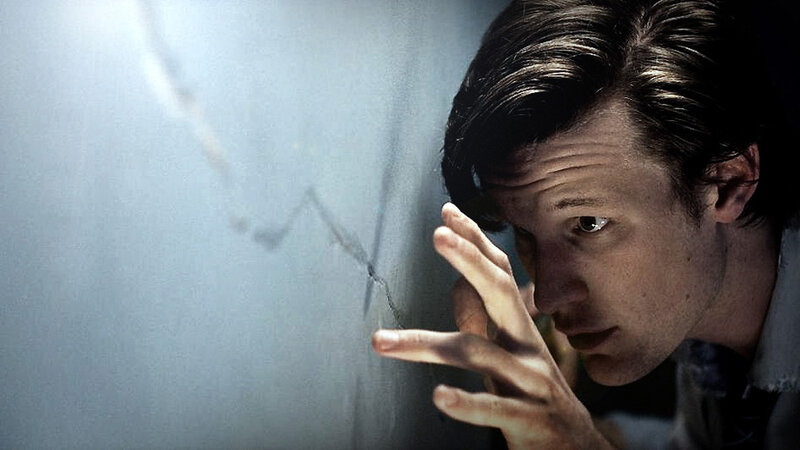 Man Touching Cracked Wall