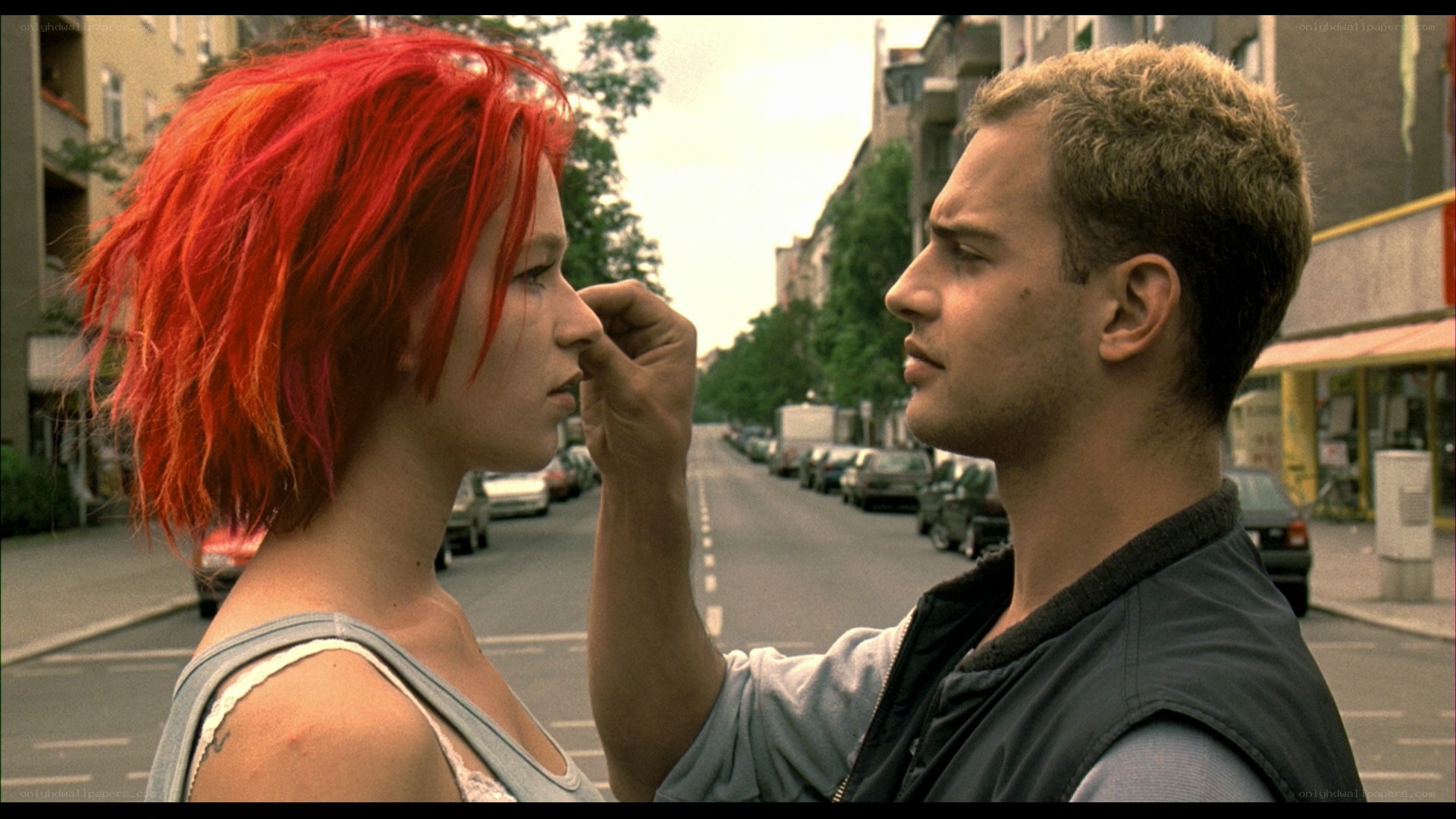 man touching woman's face