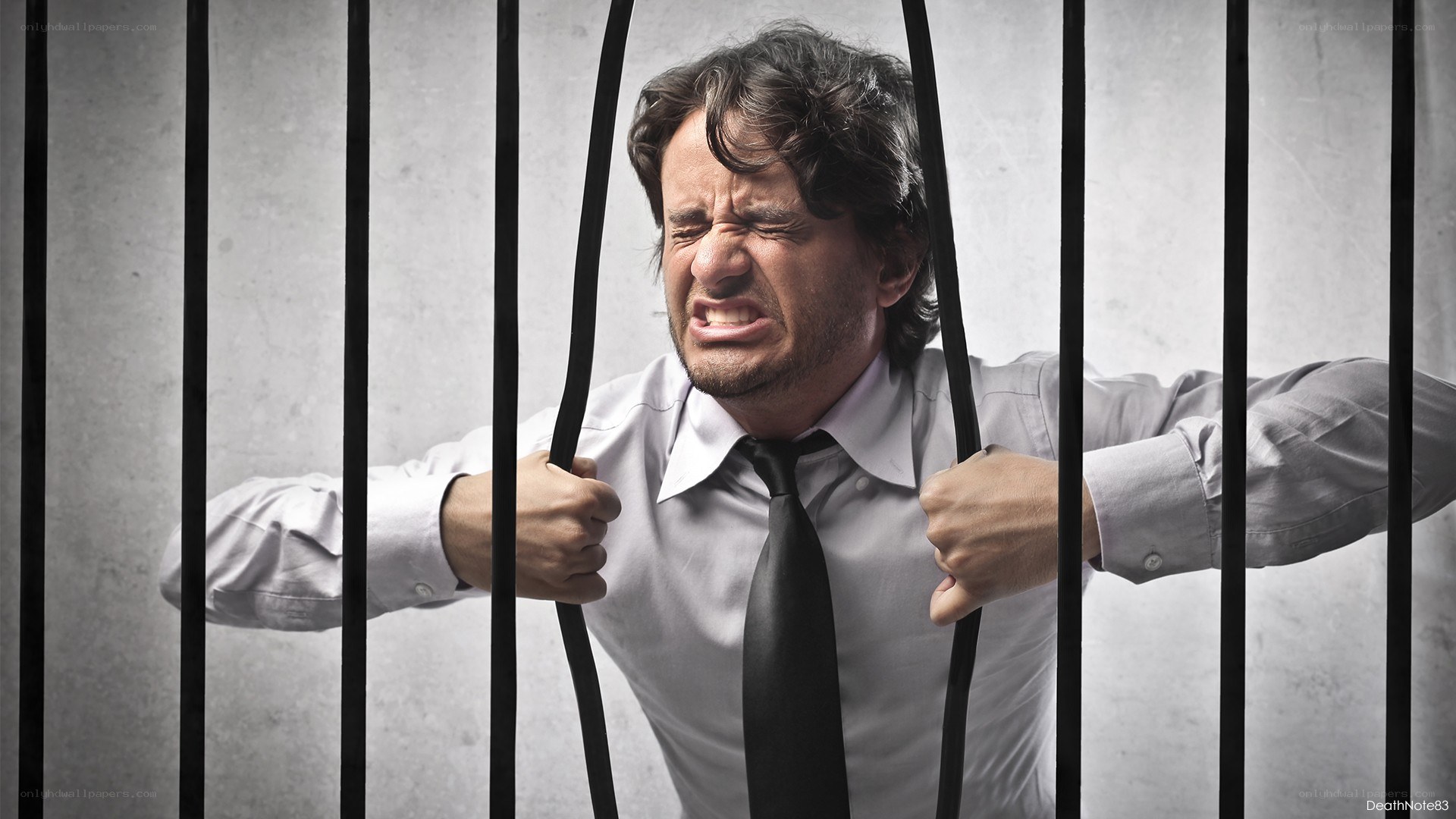man trapped behind bars
