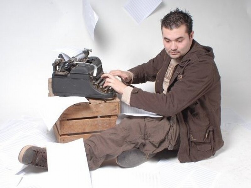 Man Typing on Typewriter — Brown