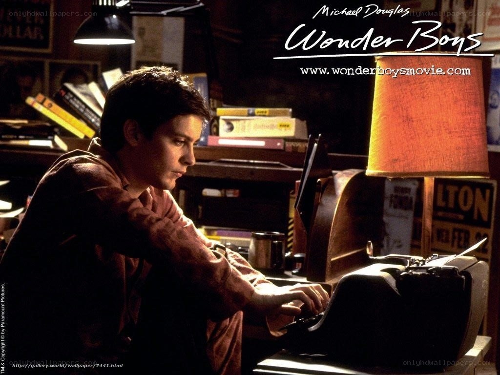 man typing on typewriter
