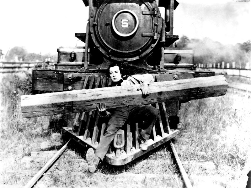 Man under train with log