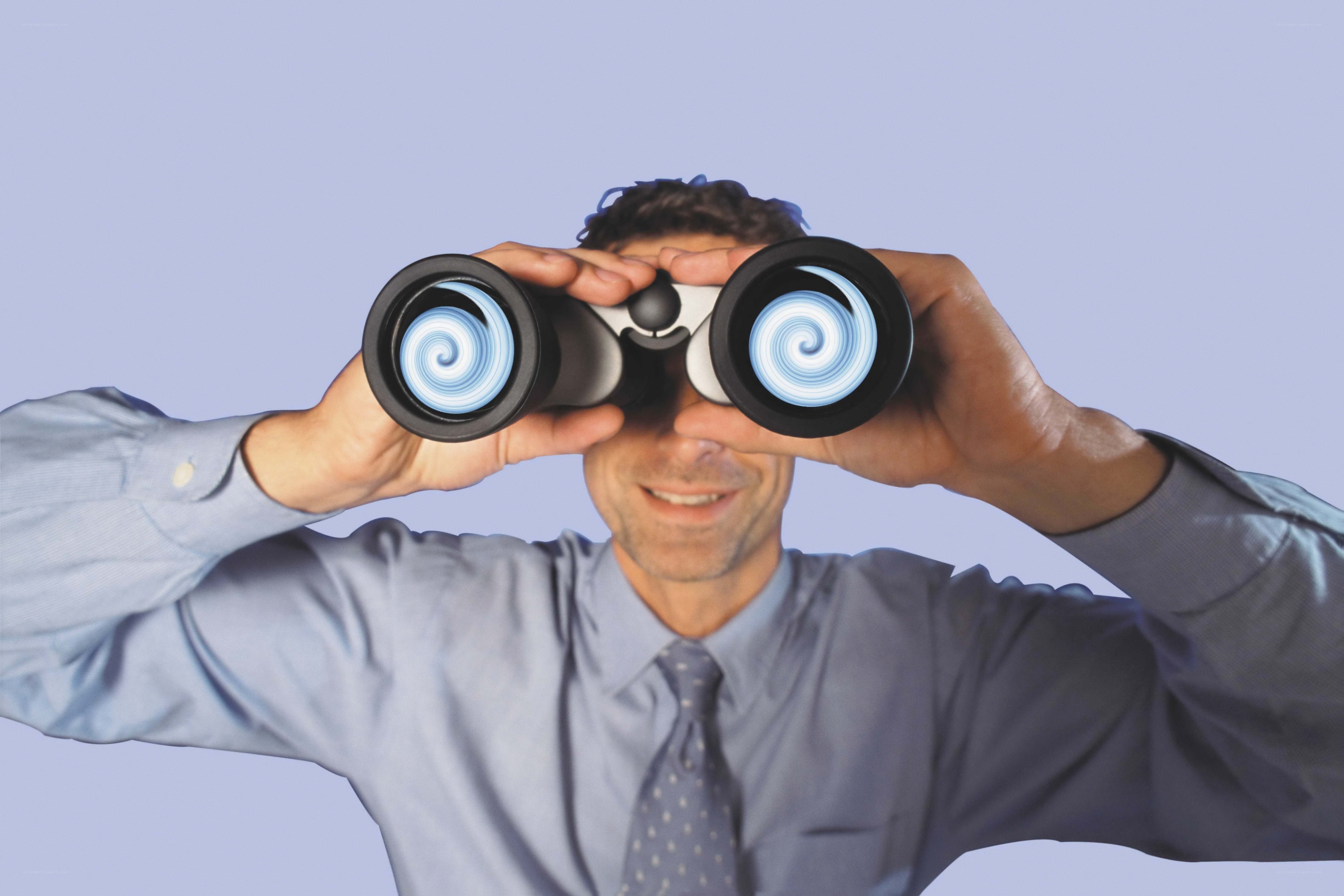 man using binoculars
