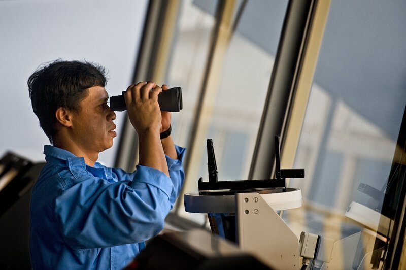 Man Using Binoculars — Blue, Focused, Afternoon