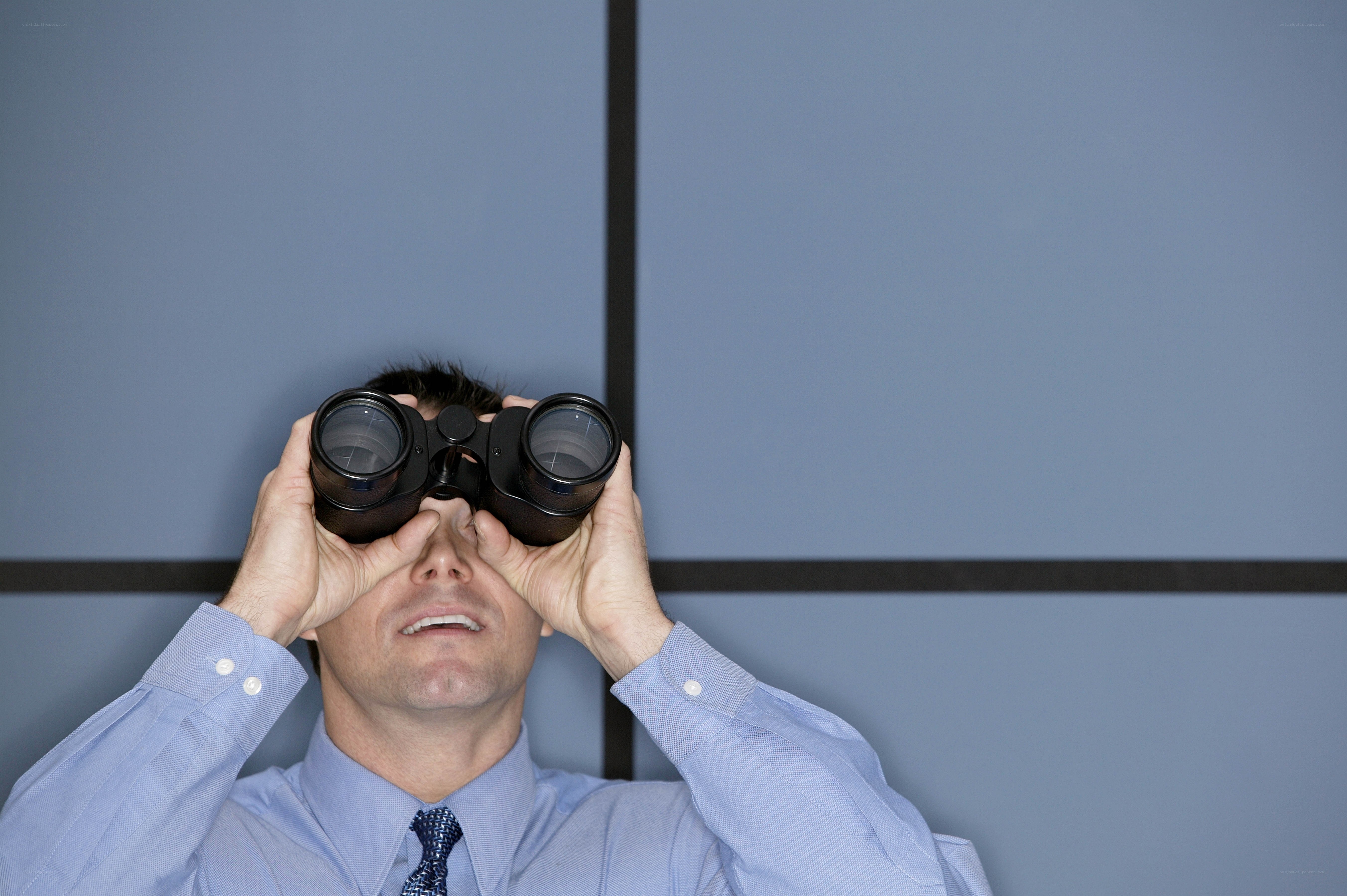 man using binoculars