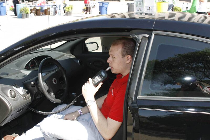 Man Using Breathalyzer