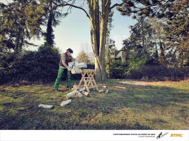 man using chainsaw outdoors