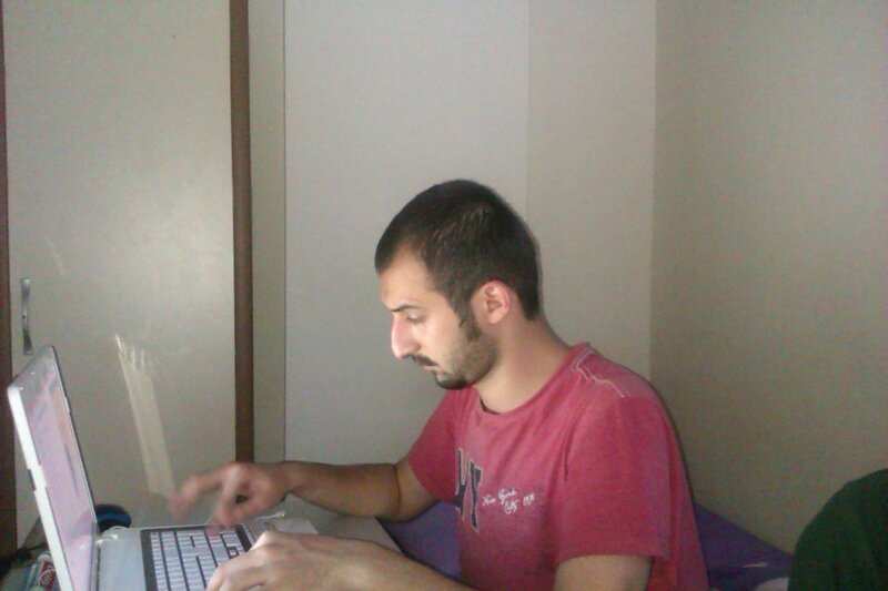 man using laptop at desk