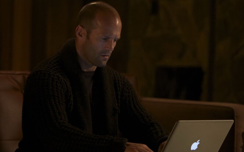 man using laptop on couch