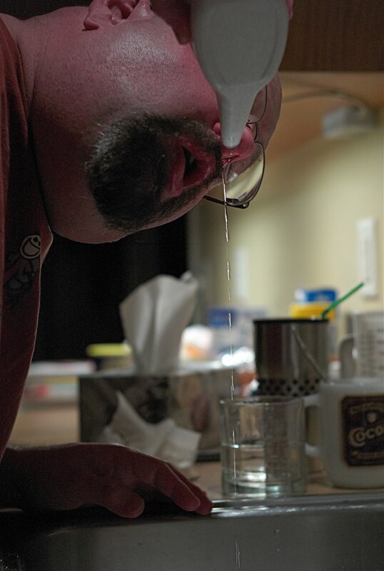 man using neti pot