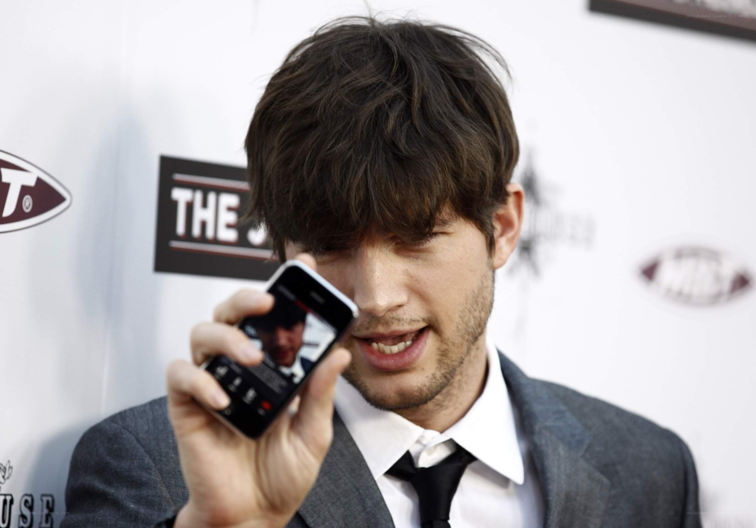 man using smartphone at event