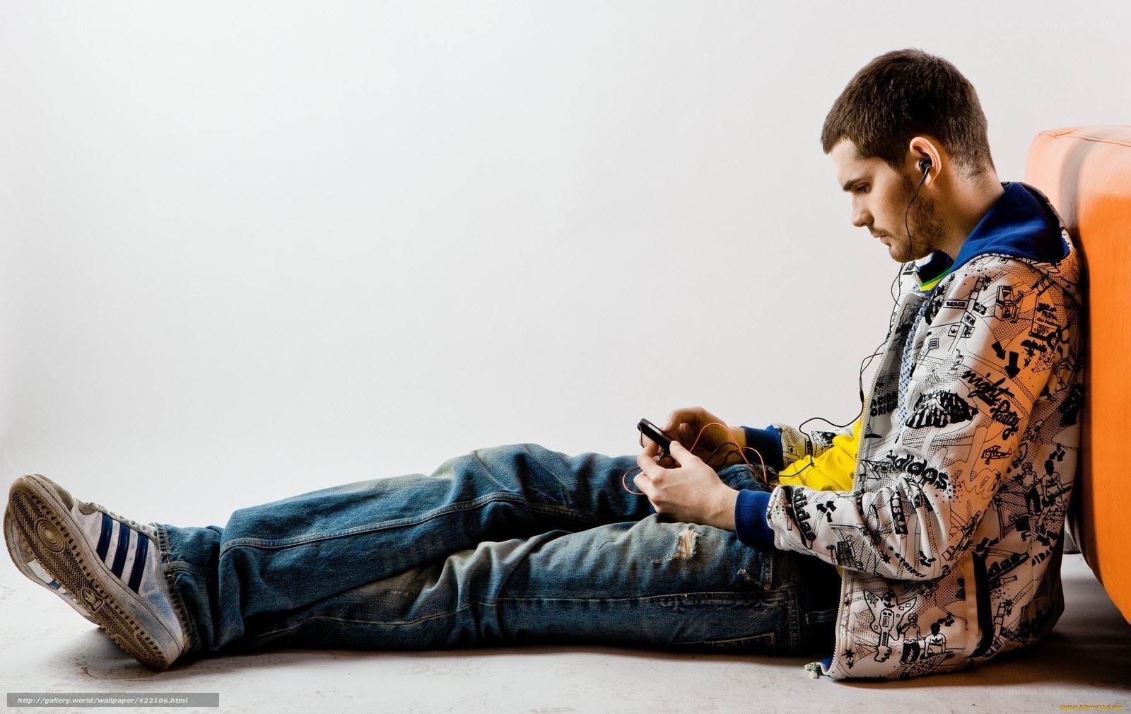 man using smartphone on floor