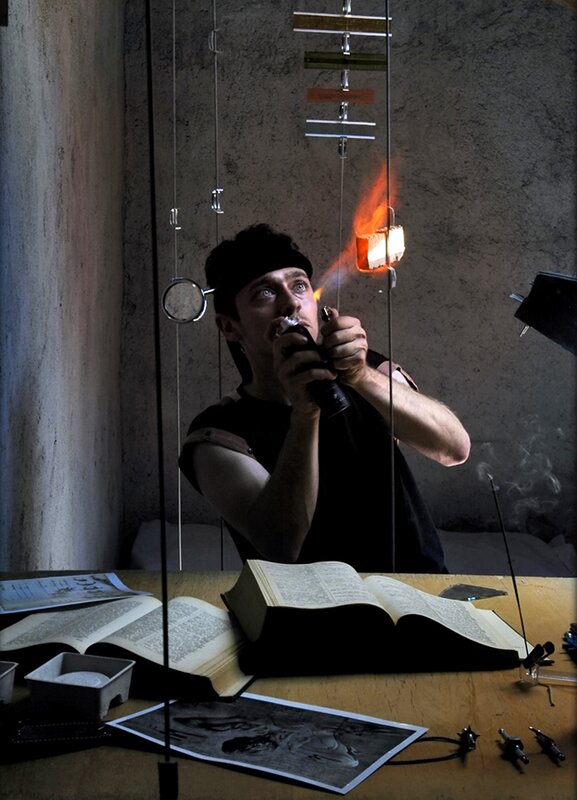Man using torch in workshop