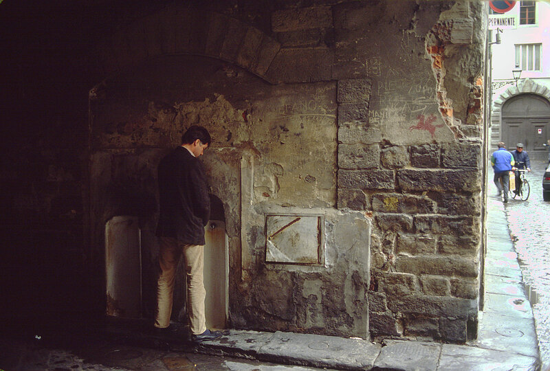 Man Using Urinal