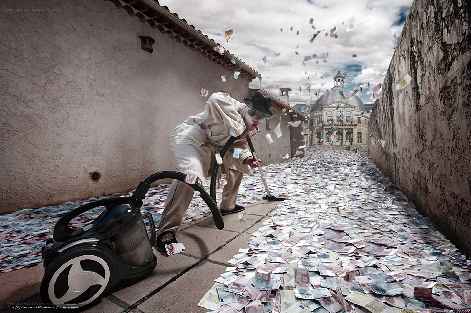 man vacuuming money