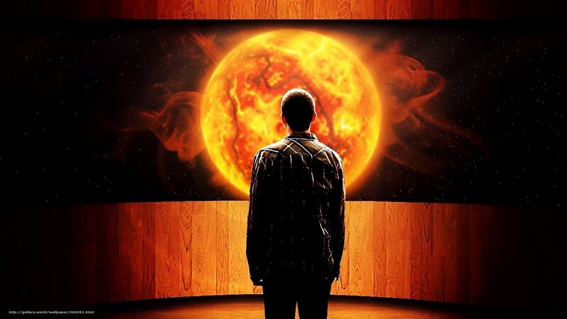 Man viewing sun on screen