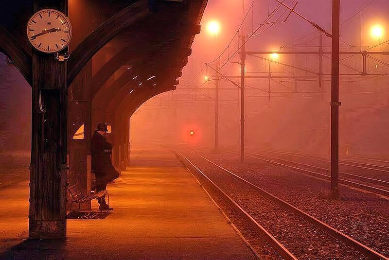 Man Waiting at Train Station