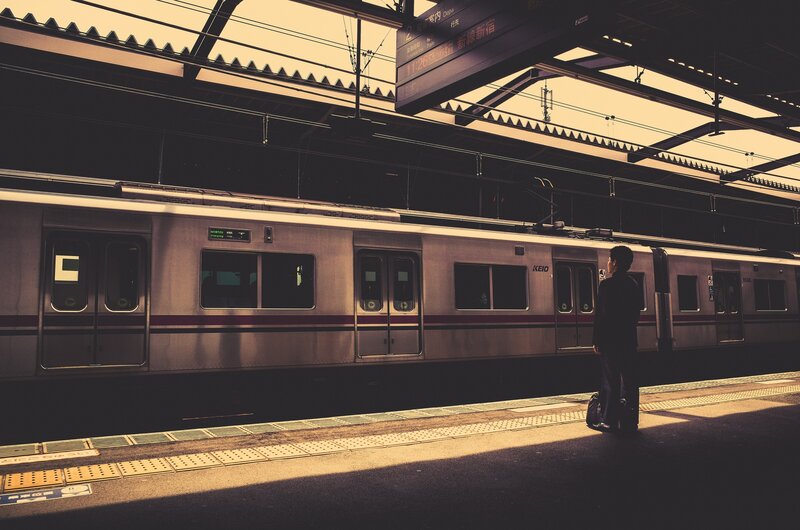 Man Waiting on Train Platform
