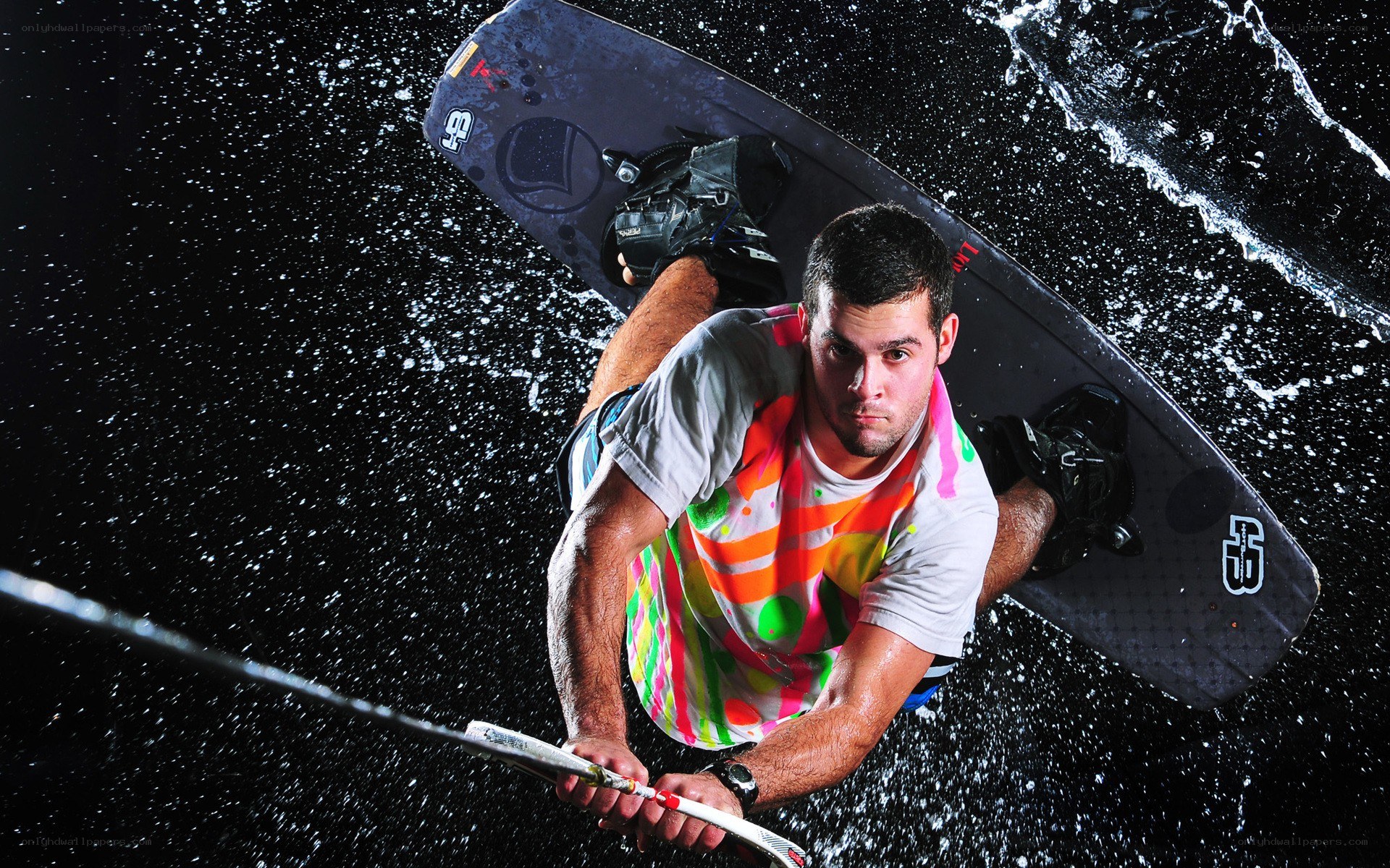 man wakeboarding at night