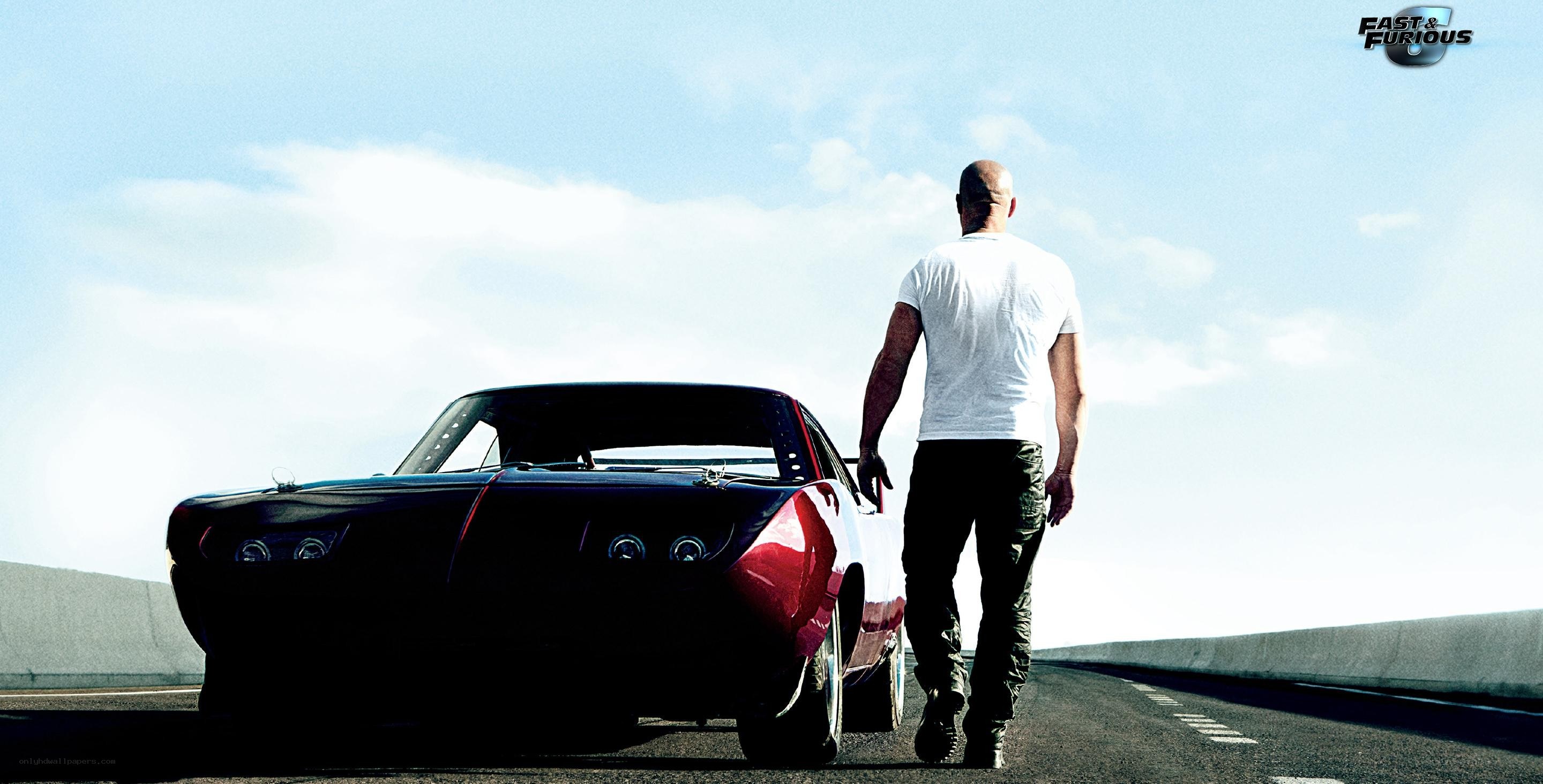 man walking beside a car