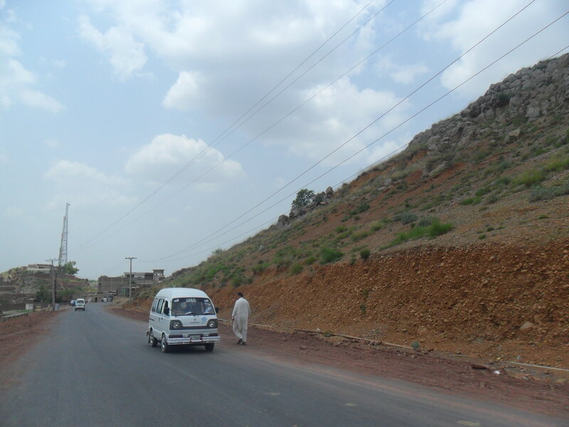 Man Walking Beside Van
