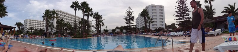 Man Walking by Pool