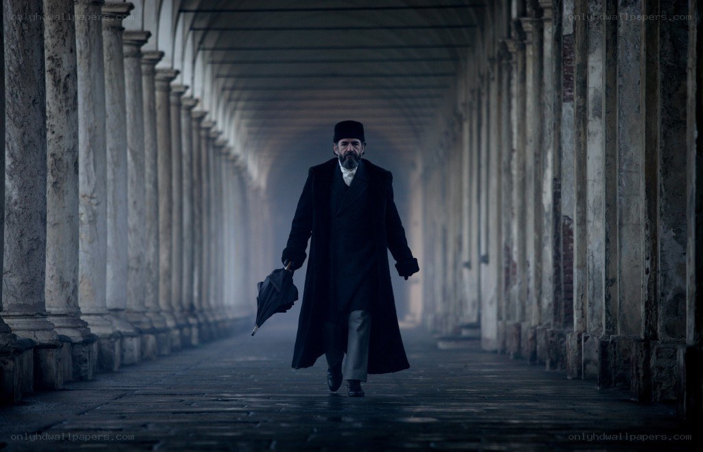 man walking in a colonnade