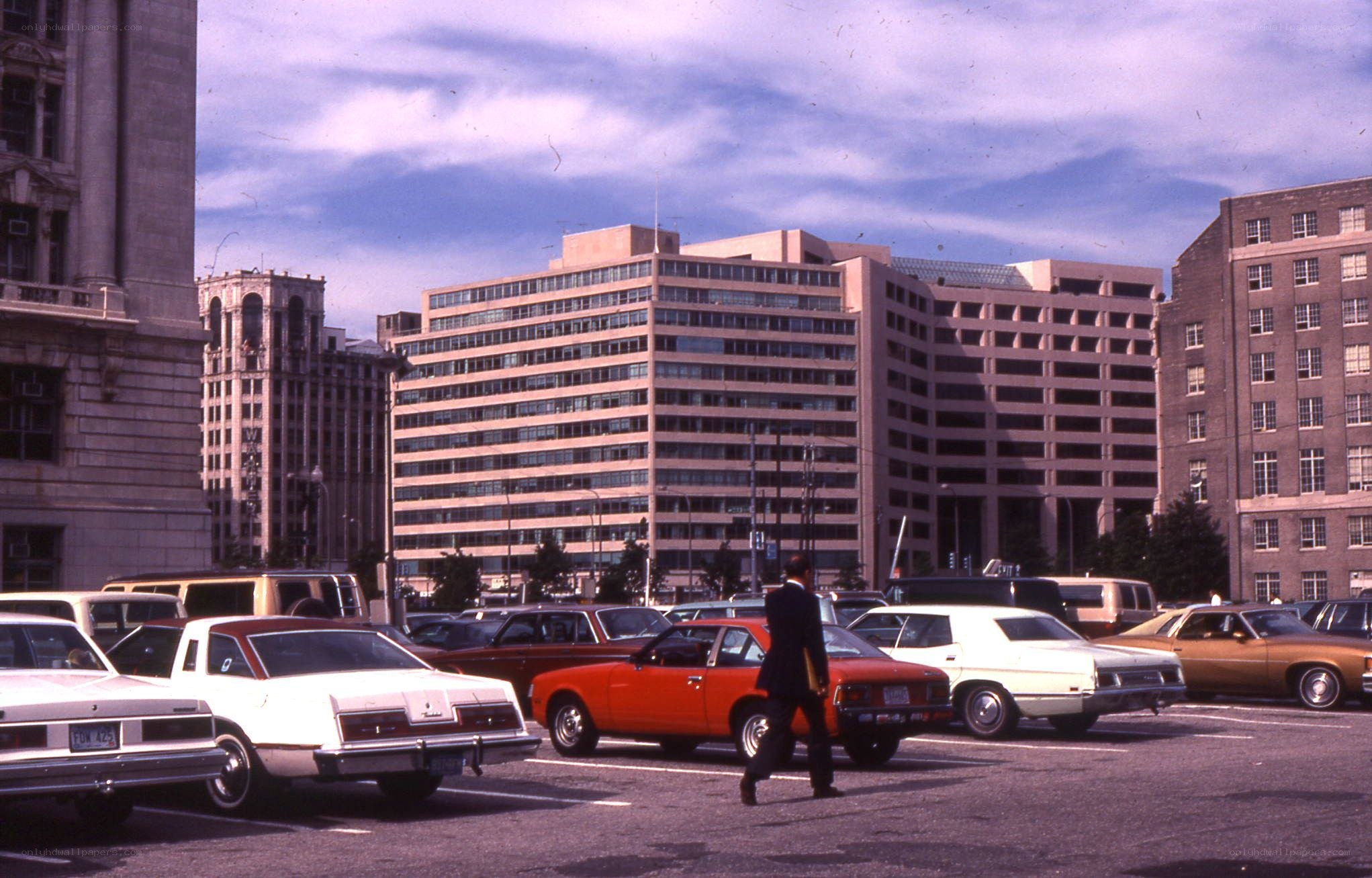 Man walking in a parking lot