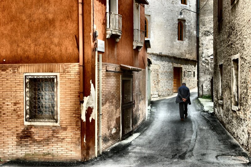 Man Walking in Alley
