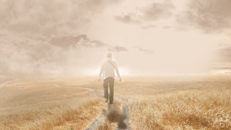 Man Walking in Field