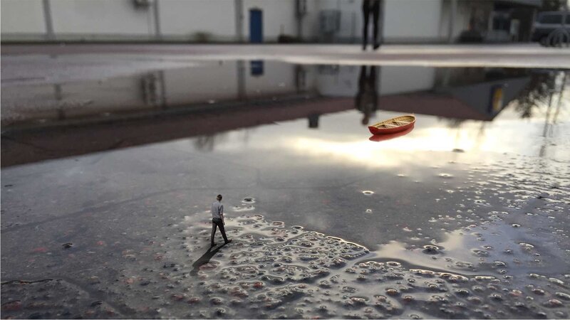 Man Walking in Puddle