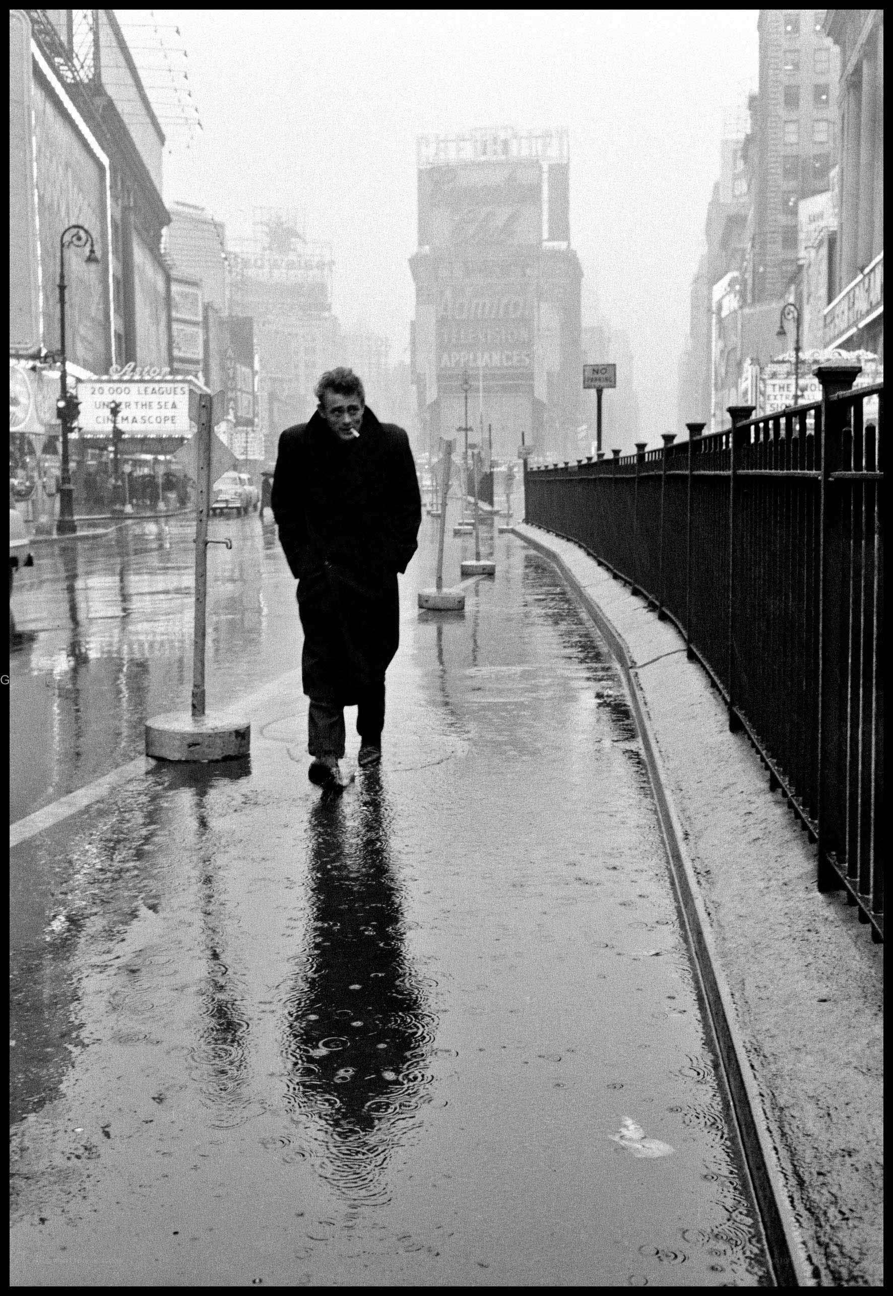 Man walking in rainy city