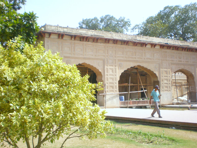 Man walking near historic building