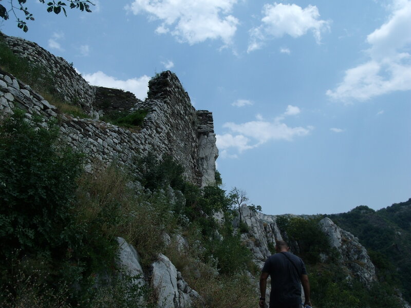 Man Walking Near Ruins